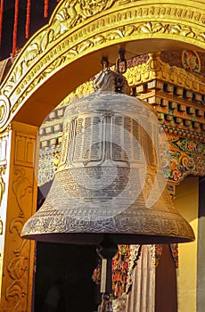 Giant buddhist prayer bell at Boudhanath stupa, Kathmandu, Nepal