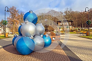 Giant Christmas baubles decoration in the park of Trzebnica