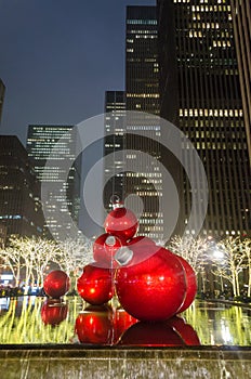 Giant Christmas Ornaments on a Fountain in Manhattan, New York City, at Night. Big Balls and Bright Lights Decoration