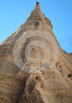 Giant cone-shaped striated rock in New Mexico