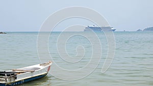 Giant cruise ship docked in the middle of ocean of Patong sea at Phuket under sunny day vacation holiday time. Luxuary Cruise ship