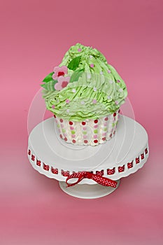 Giant cupcake with green frosting