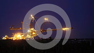 Giant excavator in a coal open pit evening