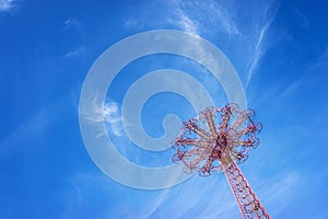 Giant ferris wheel against blue sky