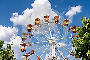 Giant Ferris Wheel In Fun Park On Blue Sky