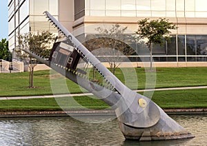 Giant fish eating a house by Joe Barrington, Hall Park, Frisco, Texas