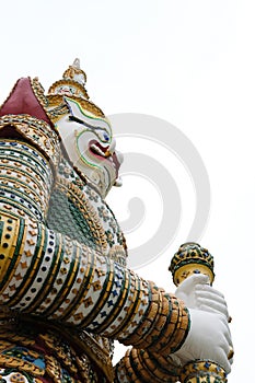giant gardian statue at temple of dawn in Bangkok, Thailand photo