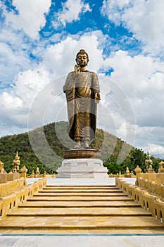 Giant golden buddha standing scenic in buddhist place