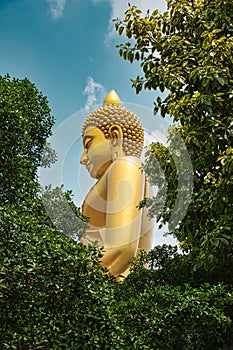 Giant golden buddha statue of Dhammakaya Thep Mongkol Buddha in construction site located at Wat Paknam Bhasicharoen temple
