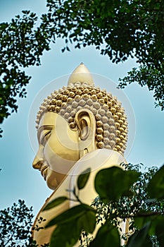 Giant golden buddha statue of Dhammakaya Thep Mongkol Buddha in construction site located at Wat Paknam Bhasicharoen temple