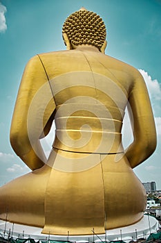 Giant golden buddha statue of Dhammakaya Thep Mongkol Buddha in construction site located at Wat Paknam Bhasicharoen temple