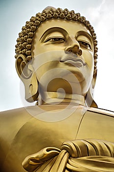 Giant golden buddha statue of Dhammakaya Thep Mongkol Buddha in construction site located at Wat Paknam Bhasicharoen temple