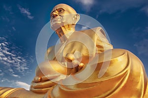Giant golden buddha statue Luang Pu Thuat in thai public buddhist temple