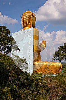 The giant golden Buddha statue sitting on the roof of the Golden Temple