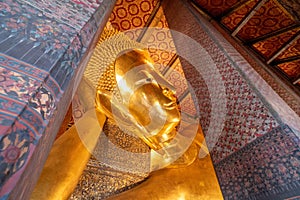 Giant golden reclining Buddha statue