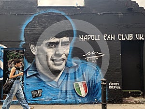 Giant graffiti art of the legendary Maradonna on the streets of Brick Lane, East London Uk