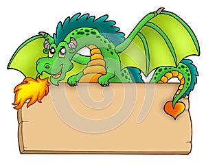 Giant green dragon holding board