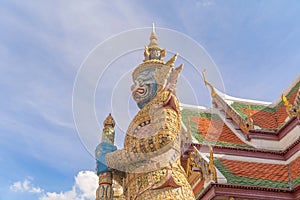 Giant guardian statue of Golden pagoda at Temple of the Emerald Buddha in Bangkok, Thailand. Wat Phra Kaew and Grand palace in old