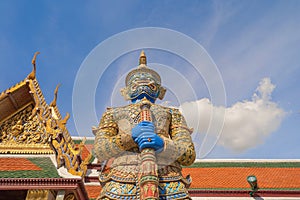 Giant guardian statue of Golden pagoda at Temple of the Emerald Buddha in Bangkok, Thailand. Wat Phra Kaew and Grand palace in old