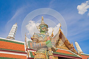 Giant guardian statue of Golden pagoda at Temple of the Emerald Buddha in Bangkok, Thailand. Wat Phra Kaew and Grand palace in old