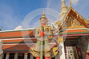 Giant guardian statue of Golden pagoda at Temple of the Emerald Buddha in Bangkok, Thailand. Wat Phra Kaew and Grand palace in old