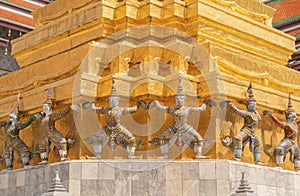 Giant guardian statue of Golden pagoda at Temple of the Emerald Buddha in Bangkok, Thailand. Wat Phra Kaew and Grand palace in old