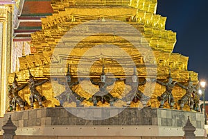 Giant guardian statue of Golden pagoda at Temple of the Emerald Buddha in Bangkok, Thailand. Wat Phra Kaew and Grand palace in old