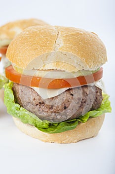 Giant homemade burger classic american cheeseburger isolated on