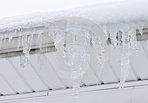 Giant Icicles hang from roof