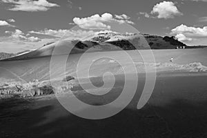 Giant inland sand dune, Bethells Beach, New Zealand. Black and white