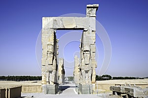 Giant lamassu statues guarding Gate of All Nations in ancient Persepolis Iran