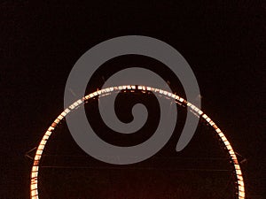 Giant loop ride at fairgrounds at night