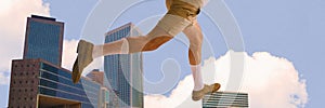 Giant man in shorts and brown shoes stepping over skyscrapers with clouds above. Contemporary art collage. Active urban