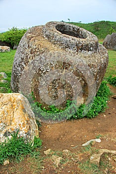 Giant megalithic stone urns at the Plain of Jars archaeological site in Loas.