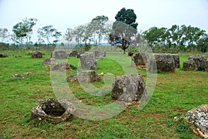 Giant megalithic stone urns at the Plain of Jars archaeological site in Loas.