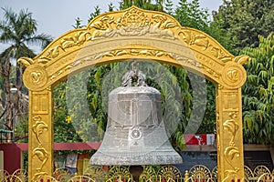 Giant metal bell with engravings at Buddhist monastery at Sarnath Varanasi India