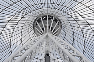 Giant metall colums holding a top of giant conic roof construction.