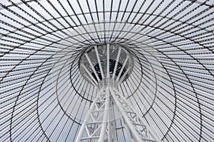 Giant metall colums holding a top of giant conic roof construction.