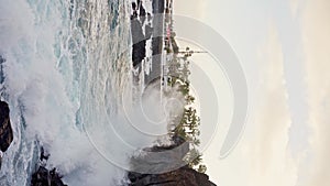 Giant ocean waves crashing and foaming on Shore. Tenerife island with big rock