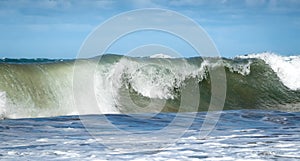 Giant ocean waves crashing in a storm out at sea