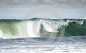 Giant ocean waves crashing in a storm out at sea