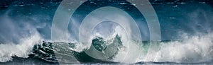 Giant ocean waves crashing in a storm out at sea