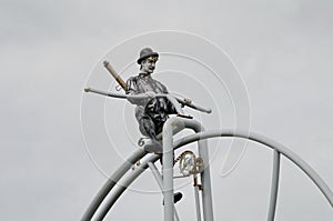 Giant Penny Farthing bicycle on a set of swings