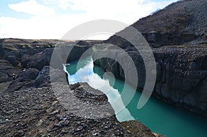 Huge river going through large rock formations in Iceland photo