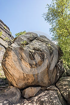 Giant rock lies upon rockfall in the countryside in the region of Pfaffenstein in Germany