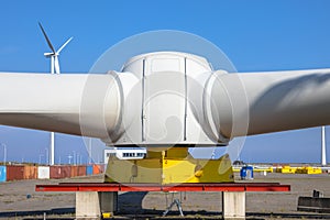 Giant rotors of wind turbine under blue sky