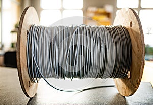 Giant skein of gray wires on a reel in manufacture