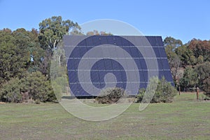 Giant solar panel facing the sun on a sunny day outdoors photo