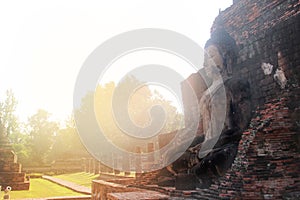 Giant statue of Buddha in Wat Mahathat , Sukhothai , Thailand.