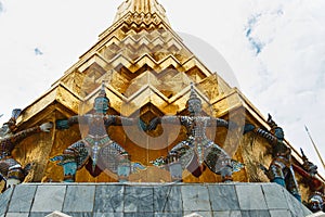 The giant statue ,The giant statue supporting golden pagoda on Grand Palace in Phra Kaew Temple, Bangkok Thailand.